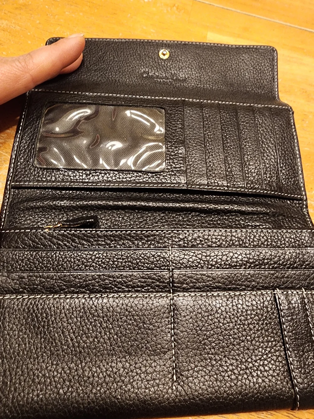 black Christian Dior pebbled leather trifold long wallet featuring gold-tone 